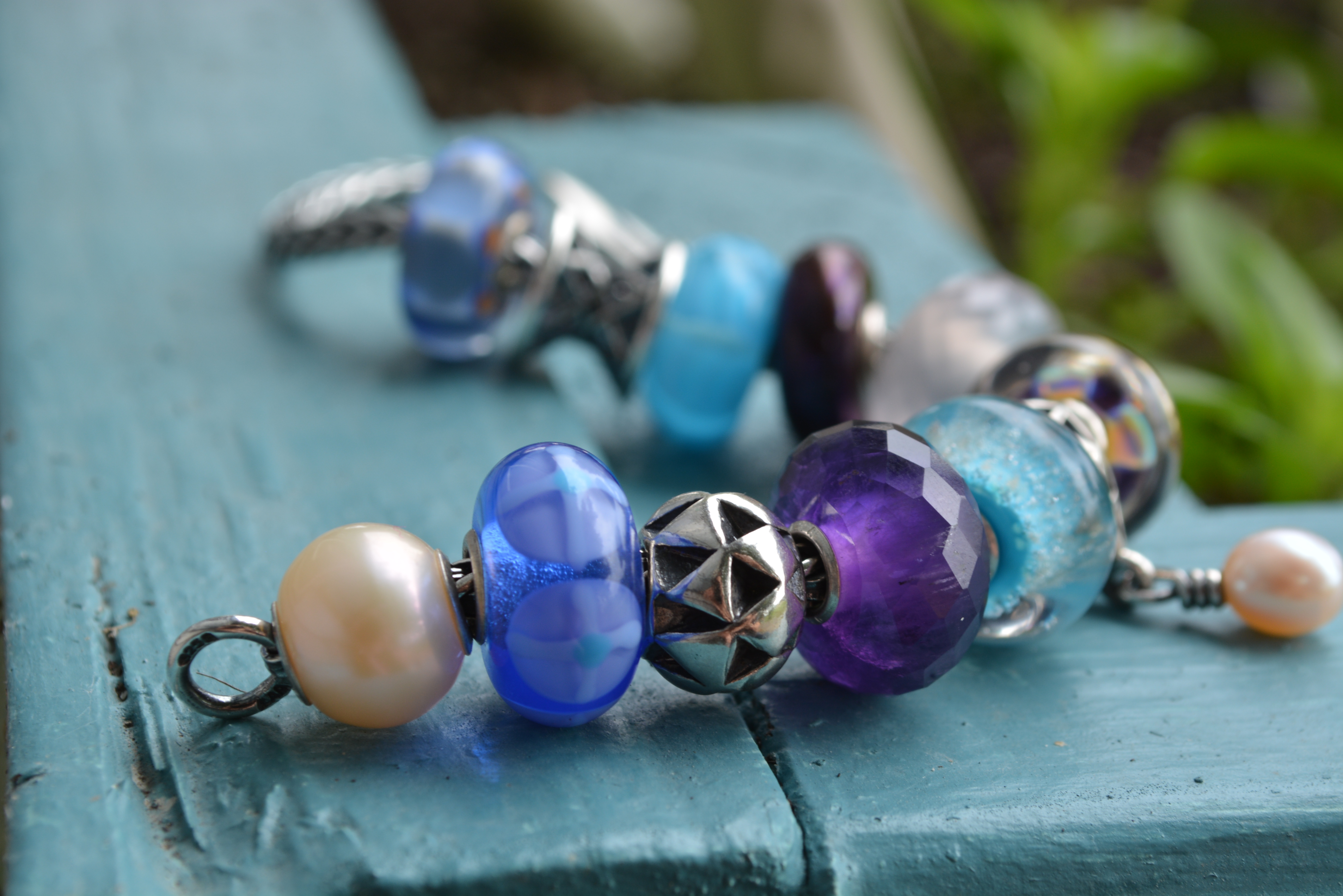 A blue, purple and pastel pink Trollbeads bracelet with OOAKs